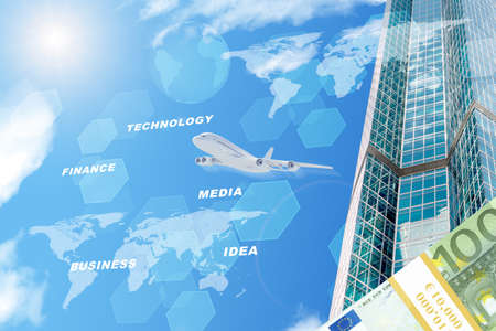 Building with world map and money on blue sky backgroundの写真素材