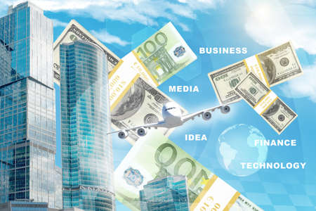 Business center with world map and money on blue sky backgroundの写真素材