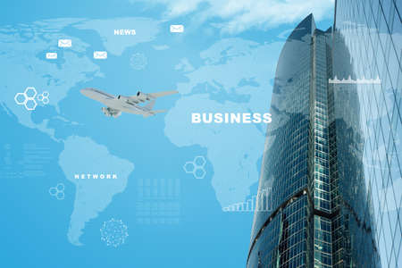 Business city with world map and jet on blue sky backgroundの写真素材