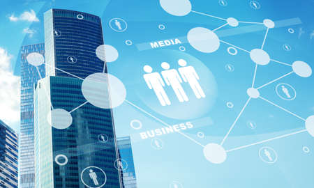 High-rise buildings with people icons on blue sky backgroundの写真素材