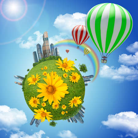 Balloon with earth and flowers on blue sky background