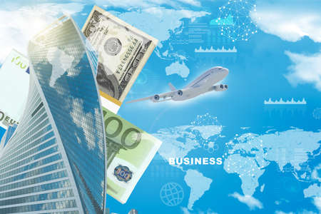 Business center with world map and cash on blue sky backgroundの写真素材