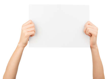 Humans hands holding big blank paper on isolated white backgroundの写真素材