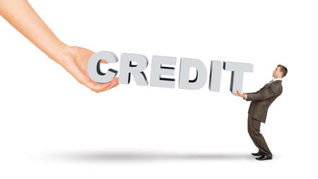 Businessman and hand holding word credit on isolated white backgroundの写真素材