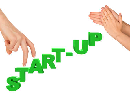 Womans fingers stepping on word start up on isolated white background, front viewの写真素材