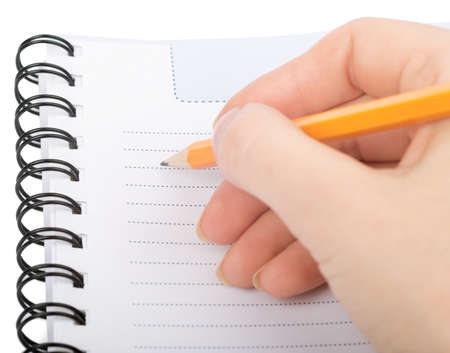 Hand writing in notebook on isolated white background