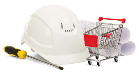 Construction helmet, screwdriver and shopping cart on isolated white backgroundの写真素材