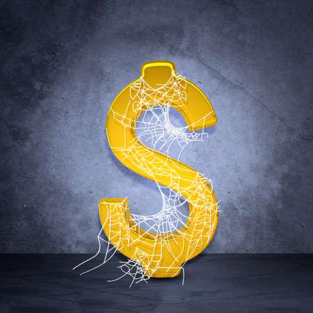 Golden dollar sign in spider web on grey wall background