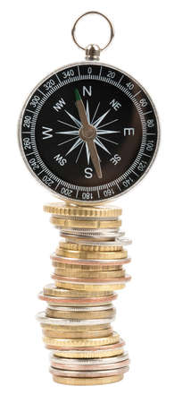 Compass on stack of coins isolated on white background