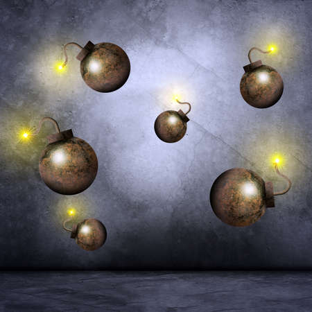 Set of iron bombs with fire on grey wall background