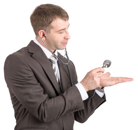 Businessman with stethoscope looking at hand isolated on white backgroundの写真素材