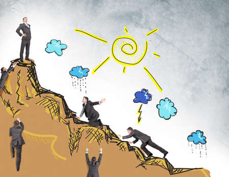 Set of businessmen climbing drawn mountain with sunの写真素材