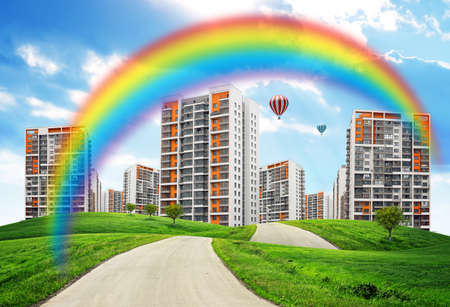 City on field with road and rainbow, nature conceptの写真素材