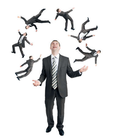 Businessman juggling little people isolated on white backgroundの写真素材
