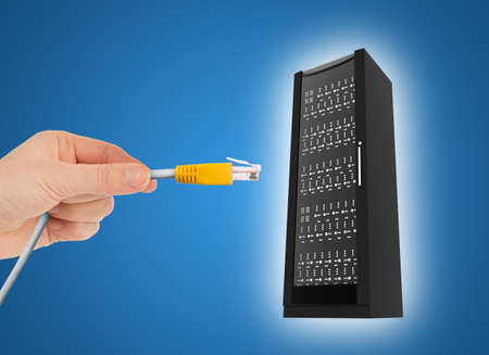 Hand holding computer cabel with iron box in sky, technology concept