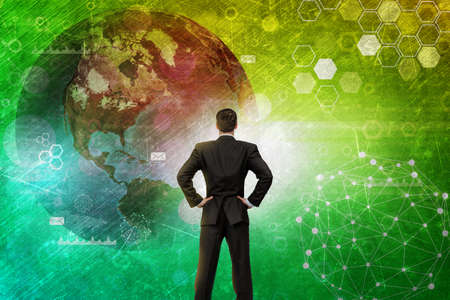 Businessman in front of holographic screen with earth globe.の写真素材