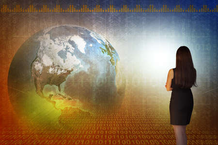 Business woman in front of holographic screen with earth globe.の写真素材