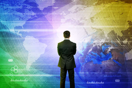 Businessman in front of holographic screen with earth globe.の写真素材