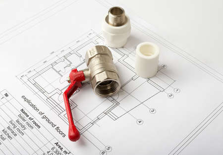 Architecture plan with red mixer tap. Building concept
