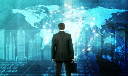 Businessman in front of holographic screen with earth globe and 3d city model.