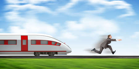 Businessman fast running away from train on trailsの写真素材