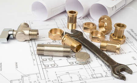 Architecture plan with plunger pins and turn-screw, closeup. Building concept