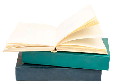 Stack of books with open book isolated on white background