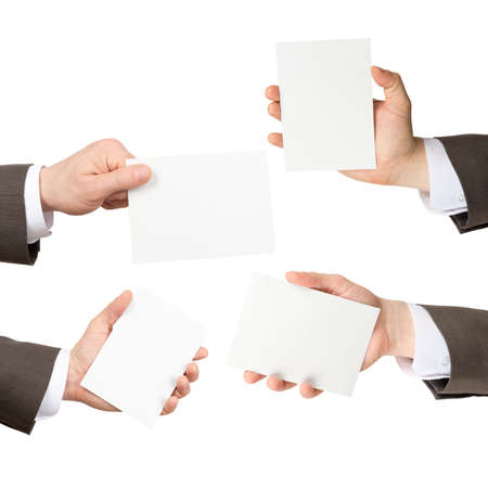 Set of businessman hands holding blank cards isolated on white backgroundの写真素材