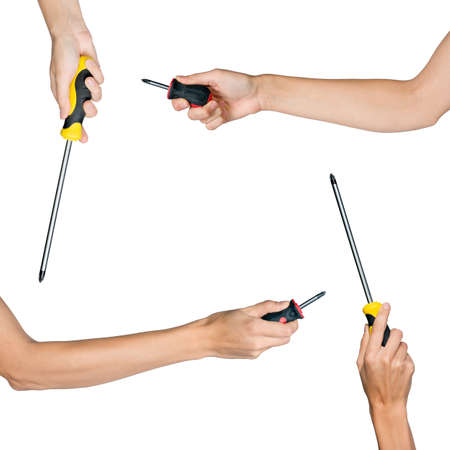 Set of human hands holding screwdrivers isolated on white background, top viewの写真素材
