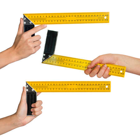 Set of human hands holding ruler isolated on white background, top viewの写真素材