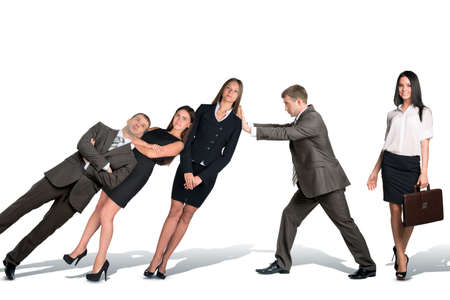 Businessman supporting falling paople isolated on white backgroundの写真素材