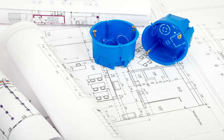 Architecture plan and rolls of blueprints with blue plastic covers. Building conceptの写真素材