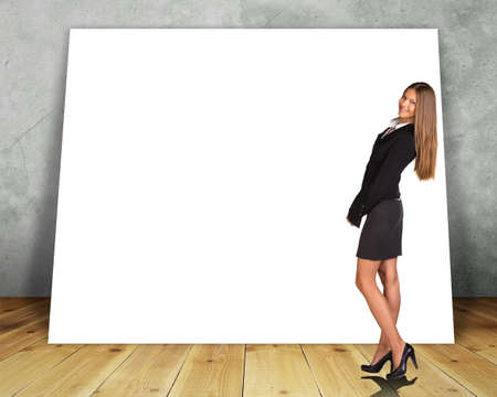 Big blank banner with woman on grey wall backgroundの写真素材