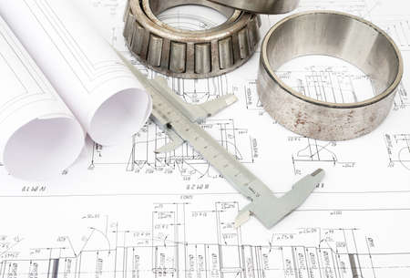 Architecture plan and rolls of blueprints with ruler and metal rings. Building conceptの写真素材