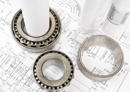 Architecture plan and rolls of blueprints with metal rings, top view. Building concept