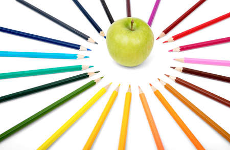 Apple with colorful crayons isolated on white backgroundの写真素材