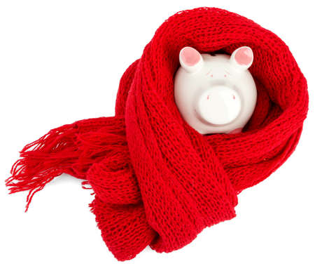 Recovering finances, Piggy bank with red scarf isolated on whiteの写真素材