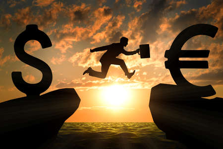 Businessman with suitcase hopping over abyss on nature backgroundの写真素材