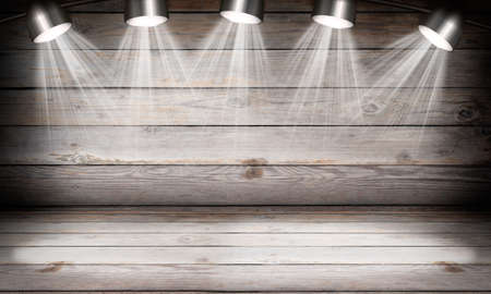 Illuminated empty brown concert stage with rays of lightの写真素材