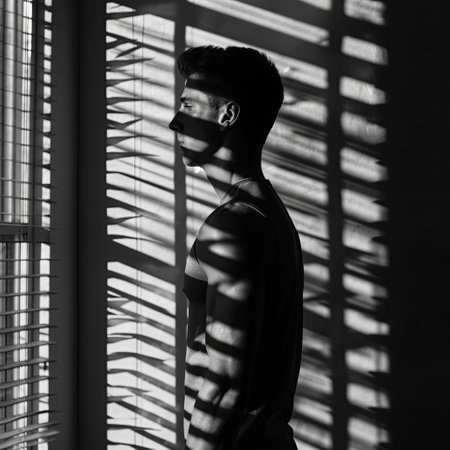 A young man at the windowの素材
