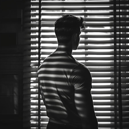 A young man at the windowの素材