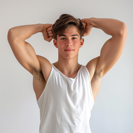 Young athletic man showing his bicepsの素材