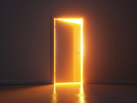 A single open door glowing with bright light in a darkened room symbolizes opportunity, hope, and the unknown.の素材