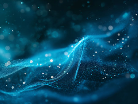 Ethereal blue waves with sparkling particles against a dark background, conveying a sense of technology or magic.の素材