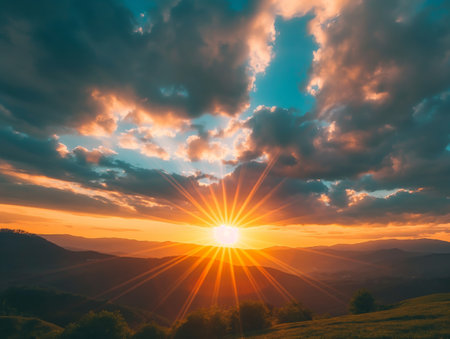 Time-lapse view of a stunning sunset over rolling hills, casting a pink hue across the skyの素材