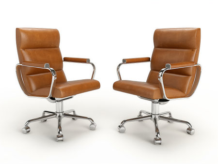 Two brown leather office chairs with chrome armrests and bases isolated on a white background, depicting a minimalist and professional setting.の素材