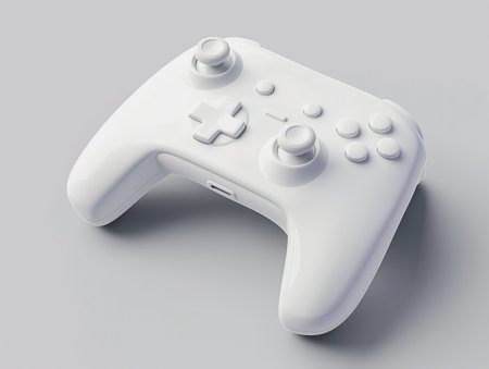 Sleek white gamepad isolated on a light gray background, symbolizing modern gaming and technology.の素材