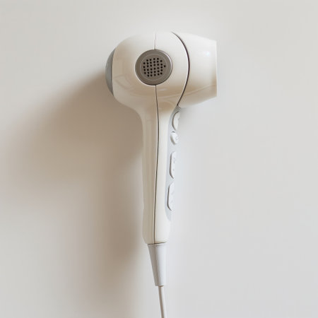 Minimalist design of a hair dryer on a plain wall, depicting simplicity and cleanliness.の素材