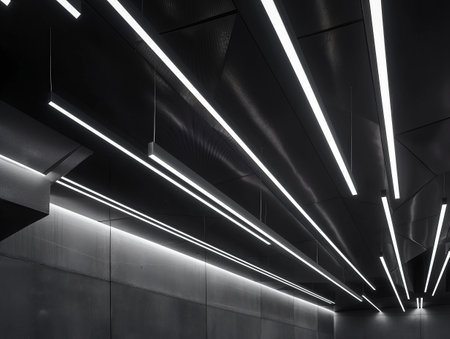 Abstract pattern of glowing LED strips on a dark ceiling.の素材