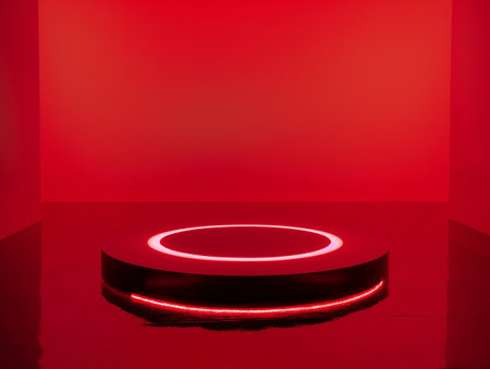 Vibrant red room featuring a bright circular light installation on the floor.の素材